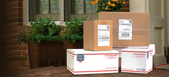 Stacked mailable boxes awaiting pickup.